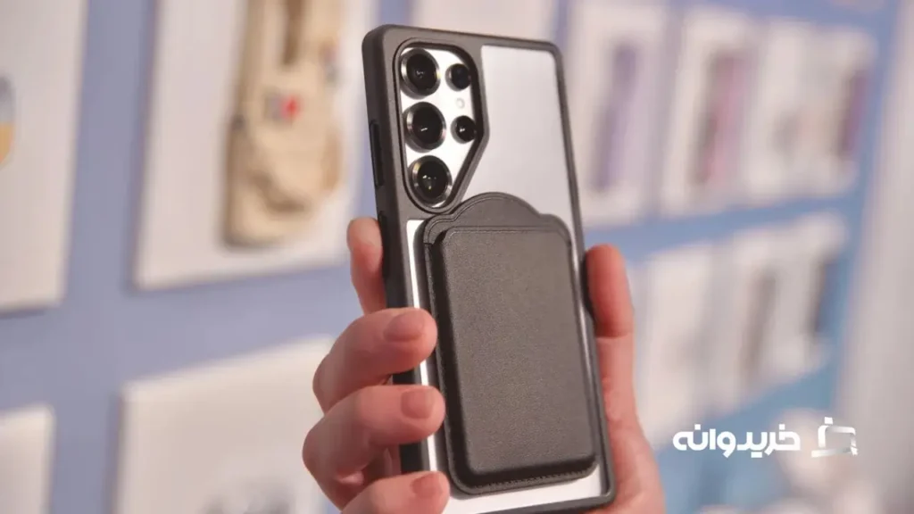 بررسی گوشی گلکسی اس 25 اولترا 16 The Samsung Galaxy S25 Ultra inside of a magnetic case, with a wallet accessory attached.
